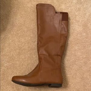 Below knee brown leather boots.